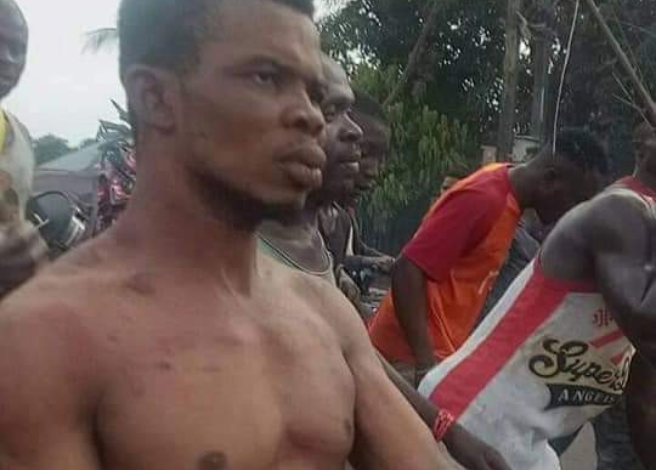 Pastor in Anambra State stripped and paraded after he was allegedly caught with charms (Photos) 9 Pastor in Anambra State stripped and paraded after he was allegedly caught with charms (Photos) 9