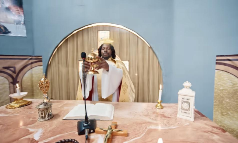 Dramatizing giving the Eucharist for a music video that has no connection with Christianity is disrespectful - Solomon Buchi slams Asake over new music video 5